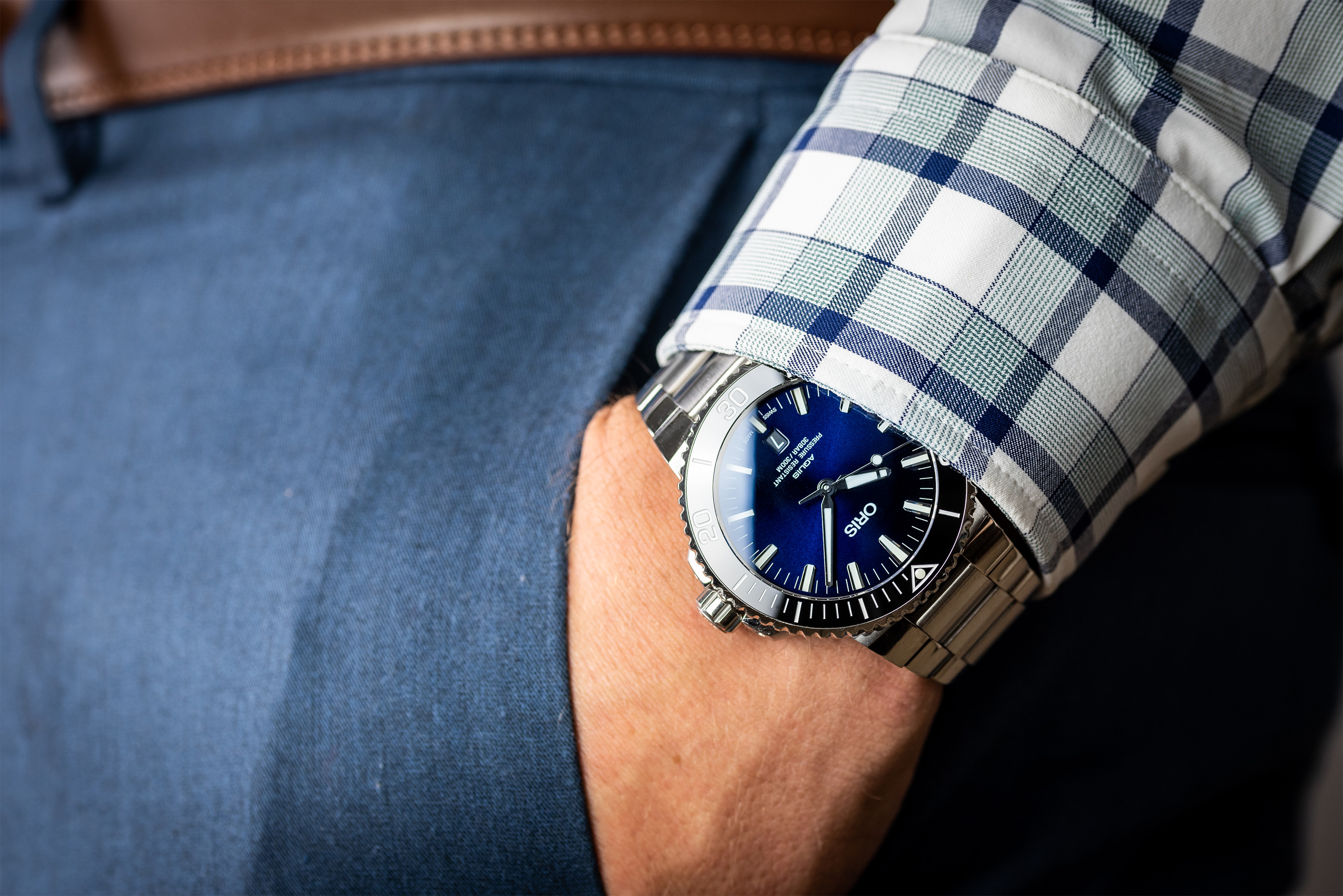 A pocket shot of the Oris Aquis, showing that this dive watch can look at home with almost any outfit